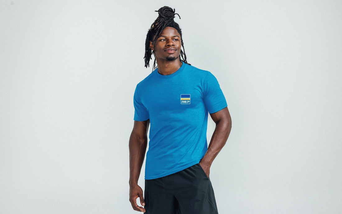 Athlete poses in a REP tee.