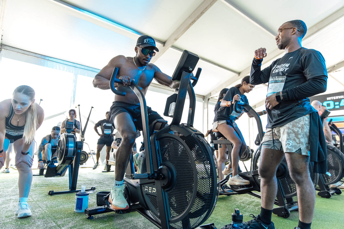 Athlete works on the Strive™ Air Bike during the Phorm Energy Training Camp Powered by REP.