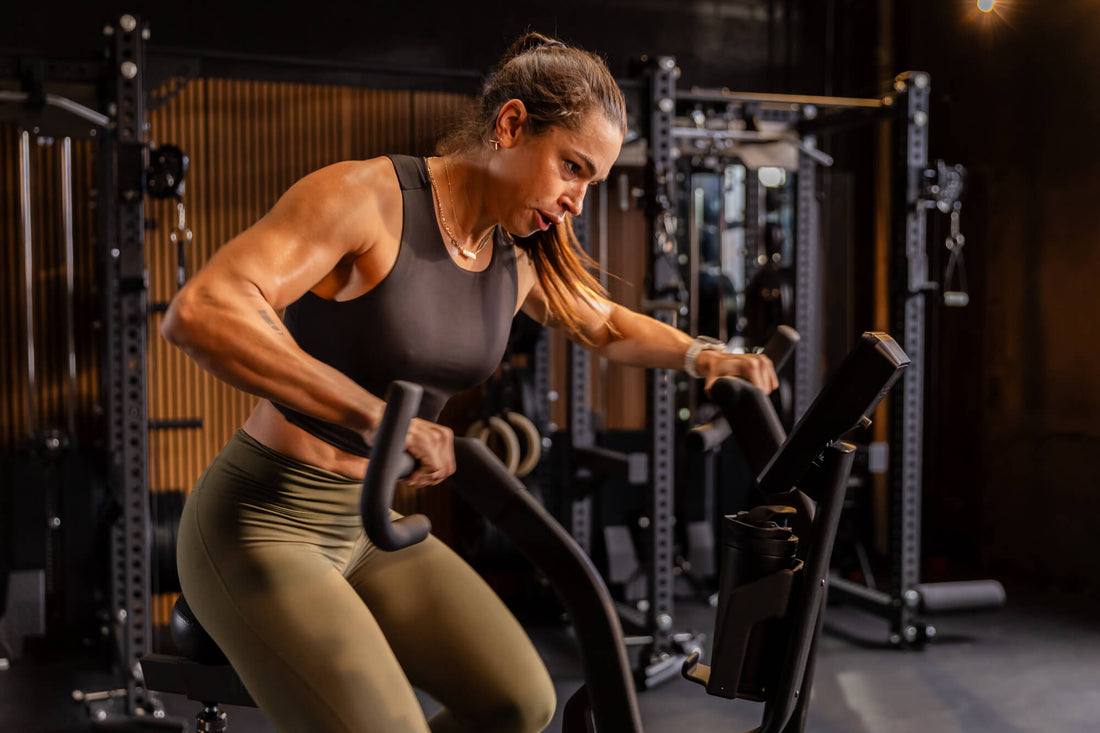 Athlete does sprint intervals on the Strive™ Air Bike featuring VPR™.