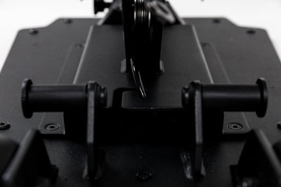 Close-up shot of the band pegs and cable housing on the Leg Extension & Leg Curl Bench Attachment
